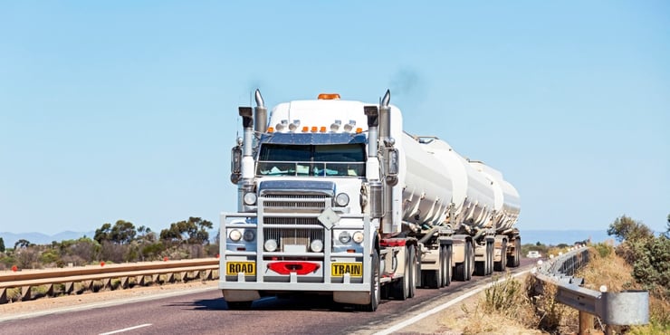 long-and-heavy-fuel-roadtrain-crossing-outback-bridge-picture-id521310226